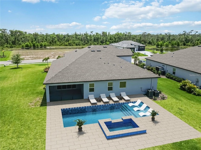 14914 15th St E, Parrish, FL 34219 - view of swimming pool with a patio, a yard, a water view, a pool with connected hot tub, and central air condition unit