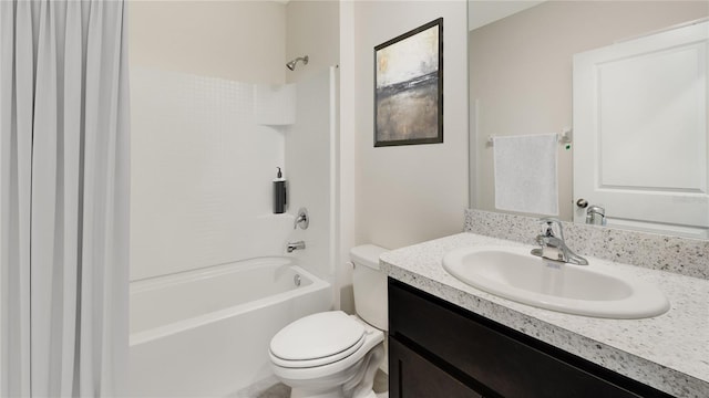 bathroom with shower / bathtub combination, vanity, and toilet