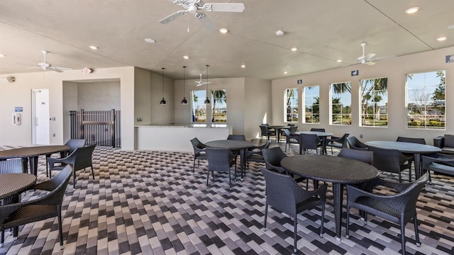 dining area with a ceiling fan and recessed lighting
