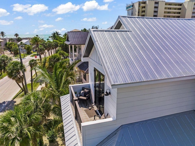 89 Avenida Messina, Sarasota, FL 34242 - view of property exterior featuring a balcony and metal roof