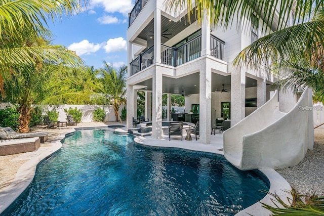89 Avenida Messina, Sarasota, FL 34242 - view of swimming pool with a ceiling fan, a fenced in pool, a fenced backyard, a patio area, and an outdoor living space