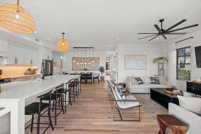 89 Avenida Messina, Sarasota, FL 34242 - living area with light wood finished floors, visible vents, recessed lighting, and ceiling fan