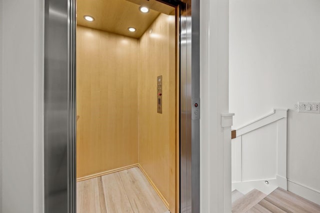 89 Avenida Messina, Sarasota, FL 34242 - interior details featuring recessed lighting, elevator, and wood finished floors