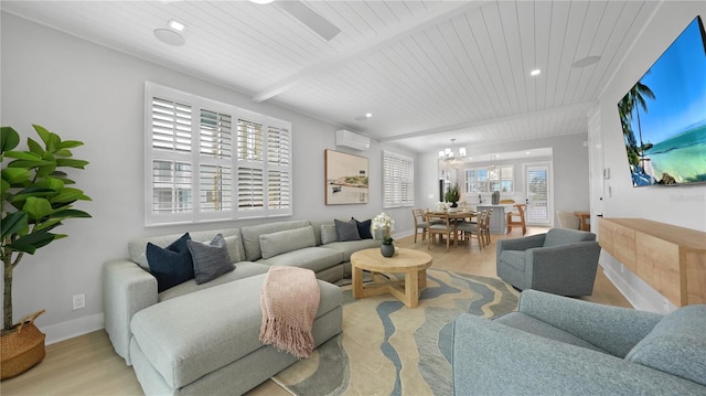 4206 Saltwater Pearl Way, Cortez, FL 34215 - living area with baseboards, recessed lighting, an inviting chandelier, light wood-style floors, and a wall mounted AC