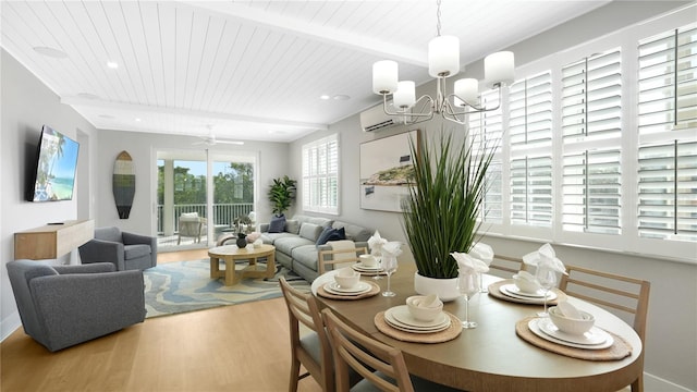 4206 Saltwater Pearl Way, Cortez, FL 34215 - dining space featuring an AC wall unit, beam ceiling, a notable chandelier, wood finished floors, and wooden ceiling