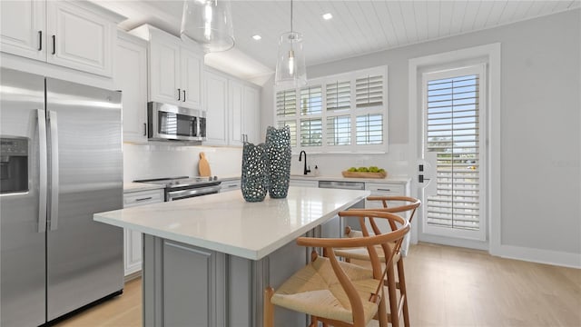 4206 Saltwater Pearl Way, Cortez, FL 34215 - kitchen with light countertops, light wood finished floors, tasteful backsplash, and appliances with stainless steel finishes