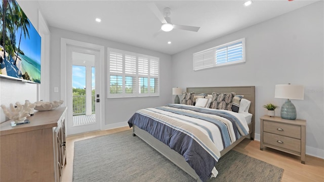4206 Saltwater Pearl Way, Cortez, FL 34215 - bedroom featuring light wood-style flooring, access to exterior, baseboards, and multiple windows
