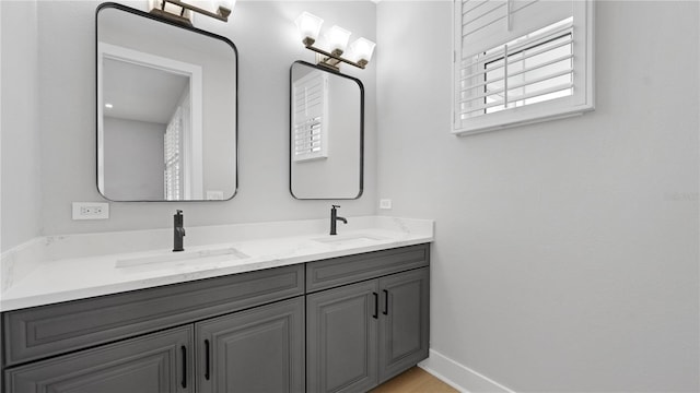 4206 Saltwater Pearl Way, Cortez, FL 34215 - bathroom featuring baseboards, a sink, and double vanity