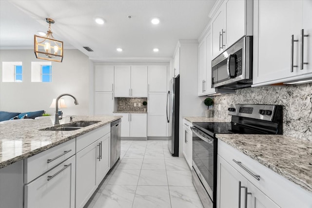 kitchen with a sink, stainless steel appliances, white cabinetry, marble finish floor, and recessed lighting