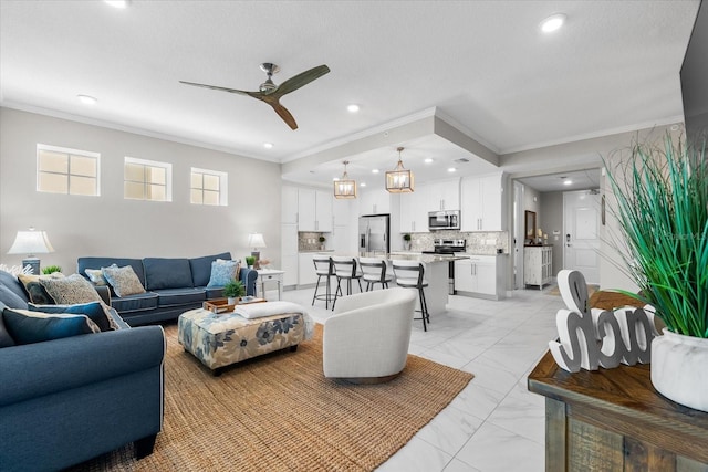 living room with a ceiling fan, marble finish floor, ornamental molding, and recessed lighting