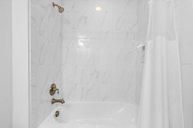 full bathroom featuring shower / bath combination with curtain