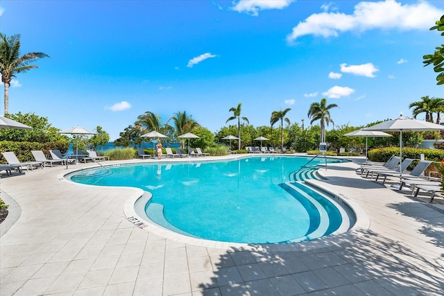 community pool featuring a patio area