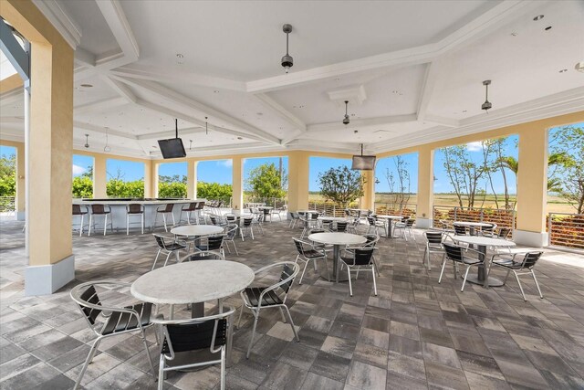 view of patio / terrace with outdoor dry bar and fence