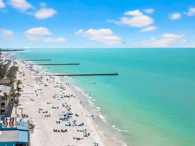 bird's eye view with a view of the beach and a water view