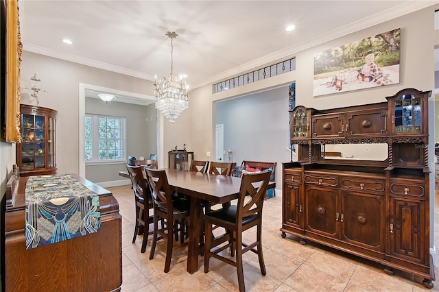 1788 Palm View Rd, Sarasota, FL 34240 - dining space with an inviting chandelier, ornamental molding, and light tile patterned floors
