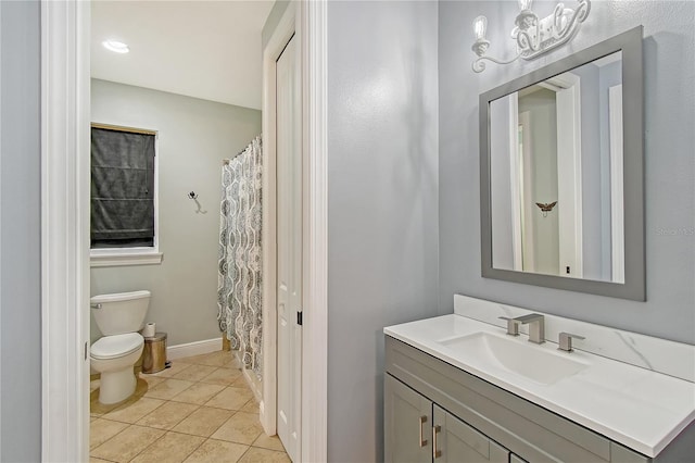 1788 Palm View Rd, Sarasota, FL 34240 - full bath with vanity, baseboards, tile patterned flooring, and toilet