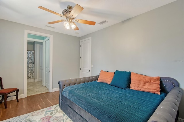 1788 Palm View Rd, Sarasota, FL 34240 - bedroom featuring baseboards, a ceiling fan, wood finished floors, and visible vents