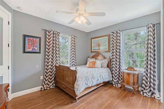 1788 Palm View Rd, Sarasota, FL 34240 - bedroom with baseboards, ceiling fan, and wood finished floors