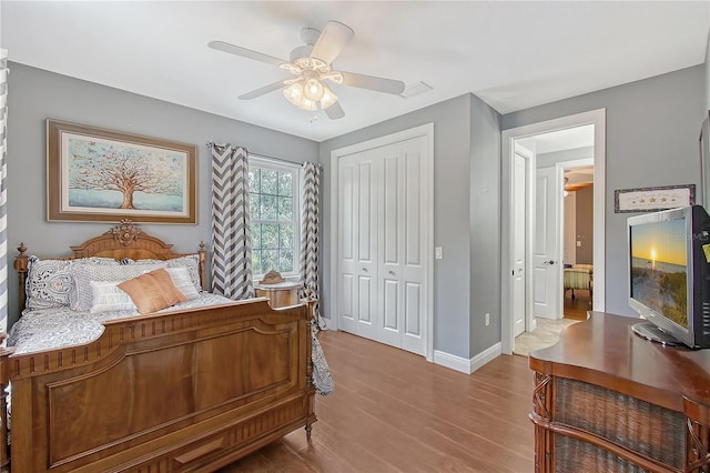 1788 Palm View Rd, Sarasota, FL 34240 - bedroom with a closet, a ceiling fan, baseboards, and wood finished floors