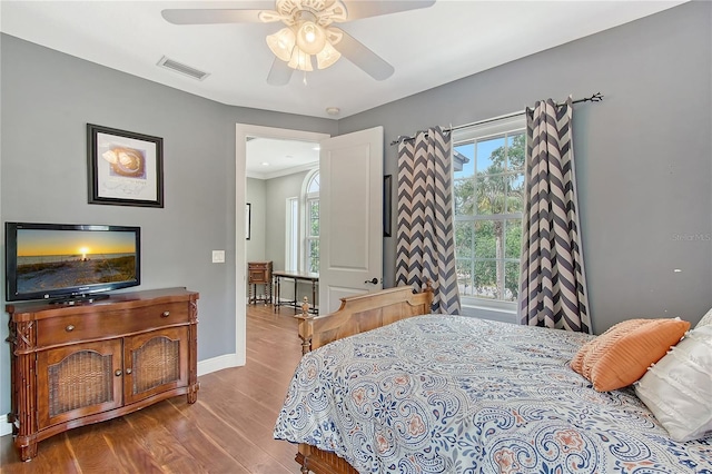 1788 Palm View Rd, Sarasota, FL 34240 - bedroom featuring visible vents, baseboards, wood finished floors, and multiple windows