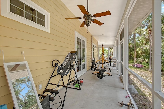 1788 Palm View Rd, Sarasota, FL 34240 - sunroom featuring concrete flooring, ceiling fan, and wood walls