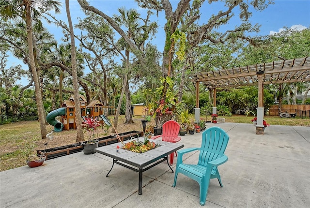 1788 Palm View Rd, Sarasota, FL 34240 - view of patio / terrace with fence, a pergola, outdoor dining area, a shed, and a playground