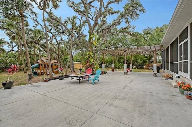 1788 Palm View Rd, Sarasota, FL 34240 - view of patio featuring a sunroom, a playground, and a pergola