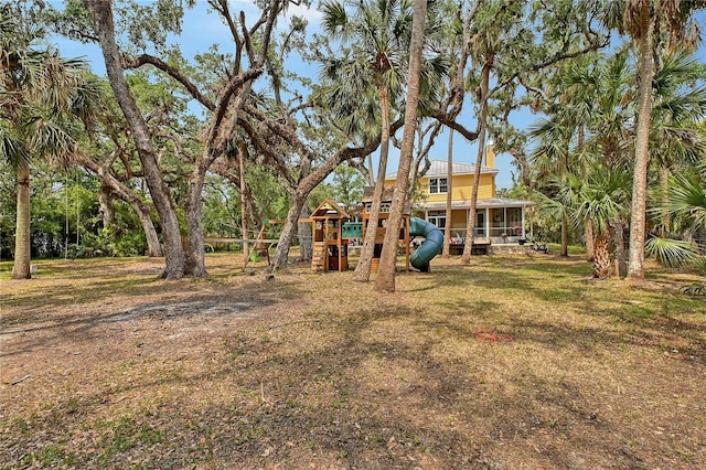 1788 Palm View Rd, Sarasota, FL 34240 - view of yard with a playground and a sunroom