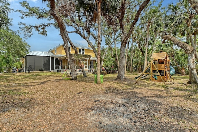 1788 Palm View Rd, Sarasota, FL 34240 - view of yard with a playground and a sunroom