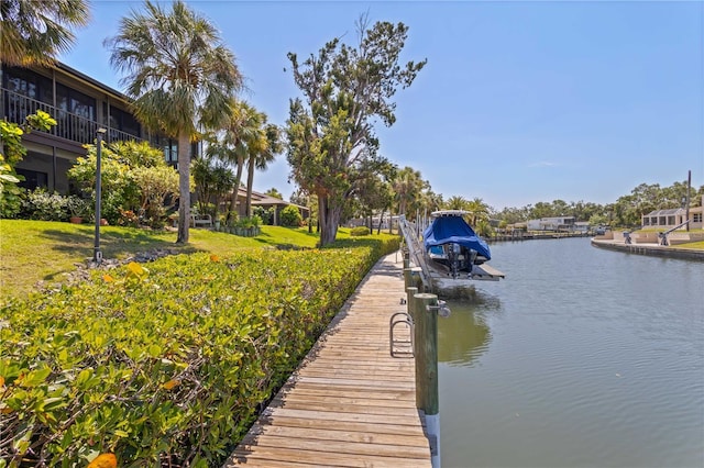 6780 Schooner Bay Cir Unit 6780, Sarasota, FL 34231 - dock area featuring a lawn and a water view