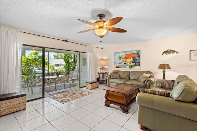 6780 Schooner Bay Cir Unit 6780, Sarasota, FL 34231 - living room featuring a textured ceiling, ceiling fan, and light tile patterned flooring