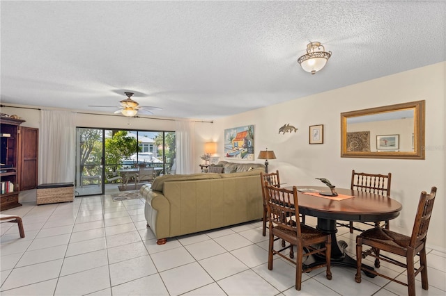 6780 Schooner Bay Cir Unit 6780, Sarasota, FL 34231 - dining area featuring light tile patterned floors, a textured ceiling, and ceiling fan