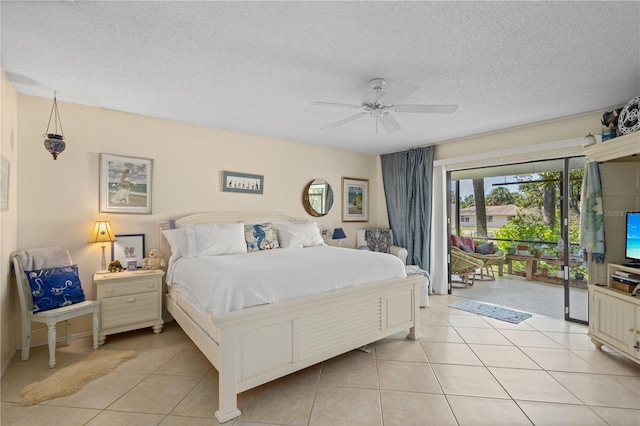 6780 Schooner Bay Cir Unit 6780, Sarasota, FL 34231 - bedroom with ceiling fan, access to outside, a textured ceiling, and light tile patterned floors