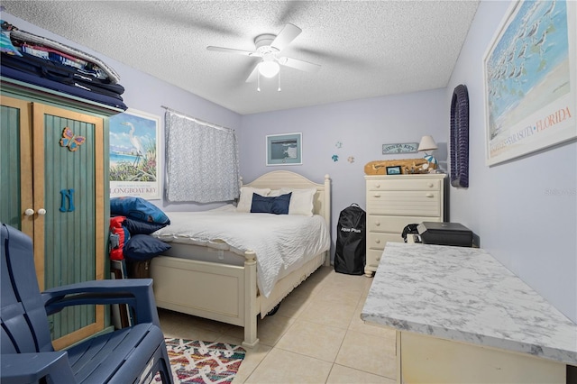 6780 Schooner Bay Cir Unit 6780, Sarasota, FL 34231 - bedroom with a textured ceiling, ceiling fan, and light tile patterned flooring