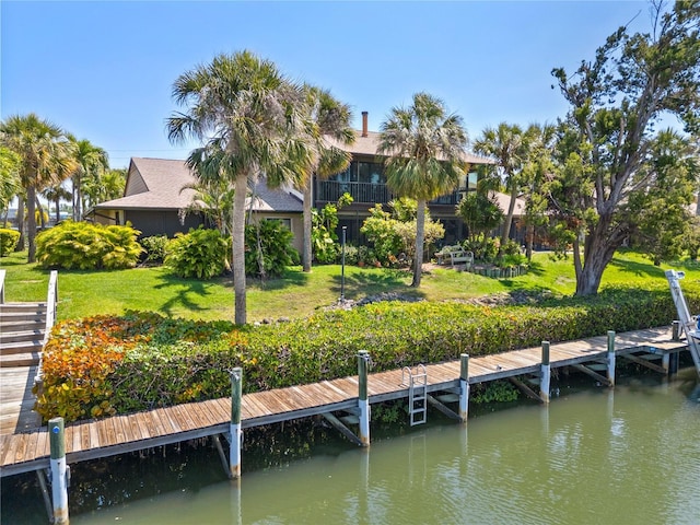 6780 Schooner Bay Cir Unit 6780, Sarasota, FL 34231 - view of dock featuring a lawn and a water view
