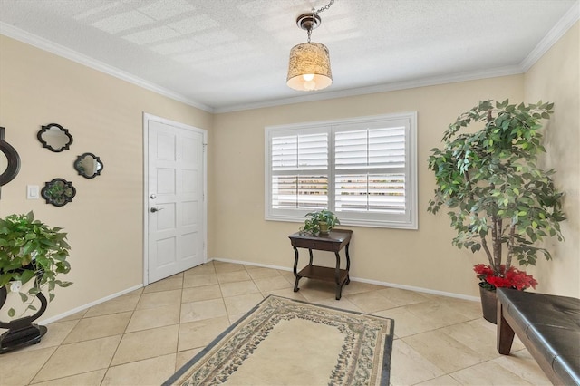 foyer entrance with crown molding, a textured ceiling, baseboards, and light tile patterned floors