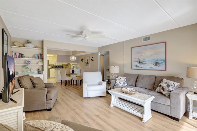 845 Benjamin Franklin Dr Unit 101, Sarasota, FL 34236 - living room featuring a ceiling fan, visible vents, and light wood-style floors