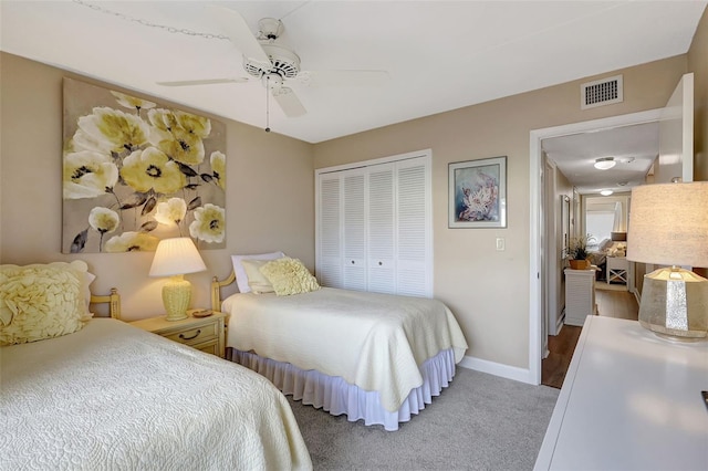 845 Benjamin Franklin Dr Unit 101, Sarasota, FL 34236 - carpeted bedroom with baseboards, visible vents, a closet, and ceiling fan