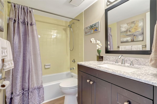 845 Benjamin Franklin Dr Unit 101, Sarasota, FL 34236 - bathroom featuring shower / bath combo with shower curtain, vanity, and toilet