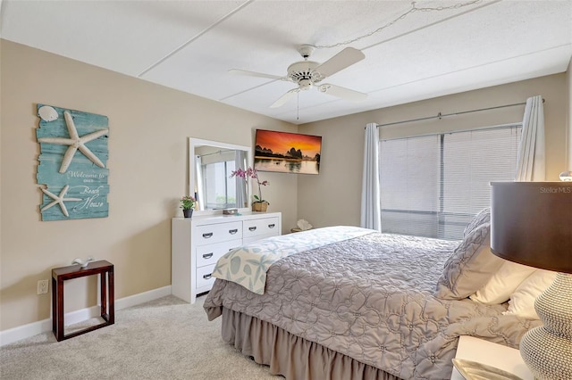 845 Benjamin Franklin Dr Unit 101, Sarasota, FL 34236 - bedroom featuring light carpet, a ceiling fan, and baseboards