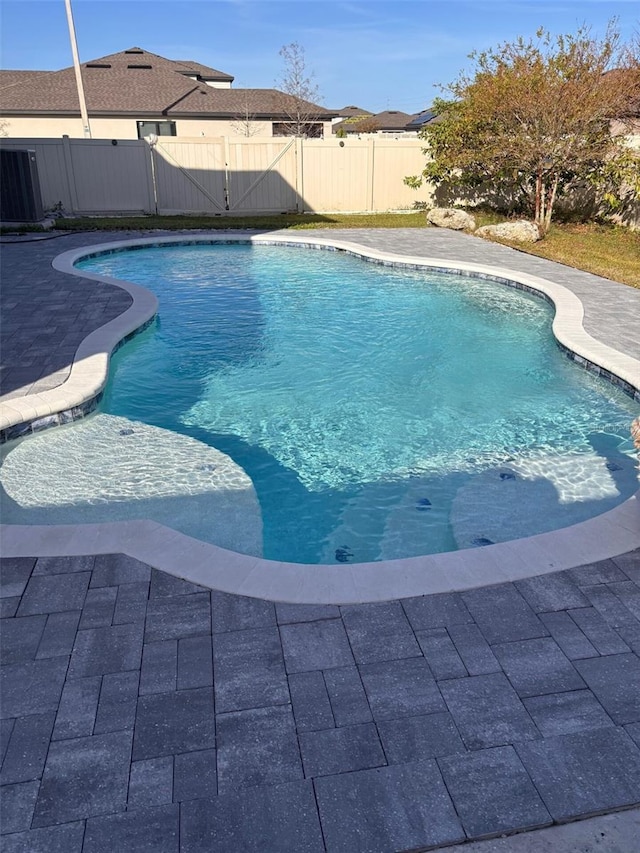 view of swimming pool with fence and a fenced in pool