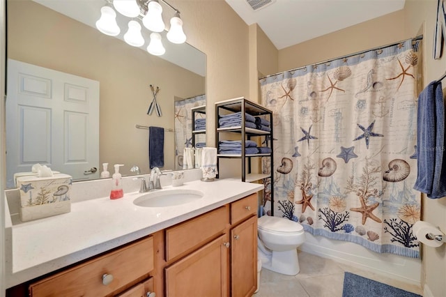 full bath with tile patterned floors, toilet, vanity, a chandelier, and shower / bath combo