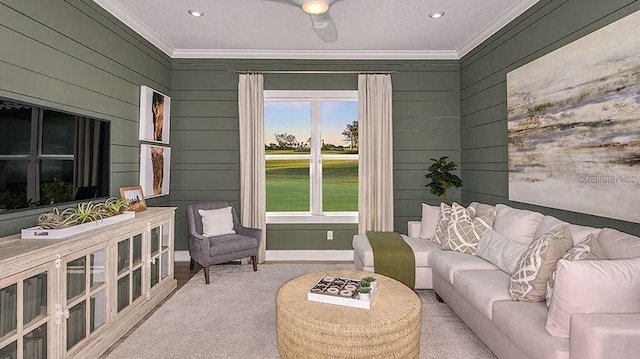 living room featuring baseboards, recessed lighting, and ornamental molding