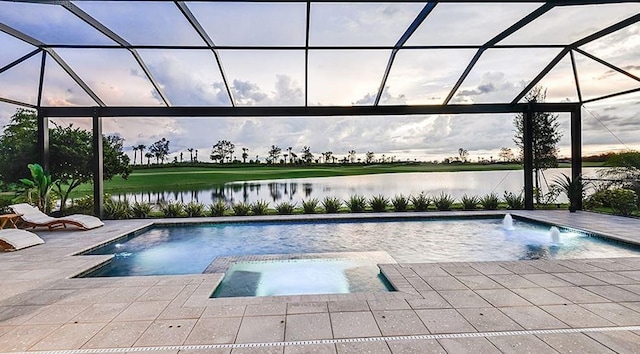 view of pool with a water view, glass enclosure, a pool with connected hot tub, and a patio