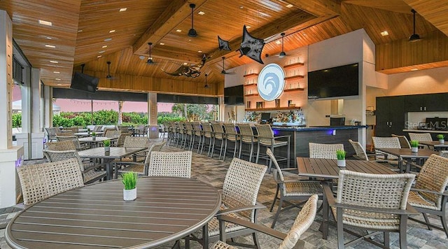 dining area featuring high vaulted ceiling, wood ceiling, and beamed ceiling