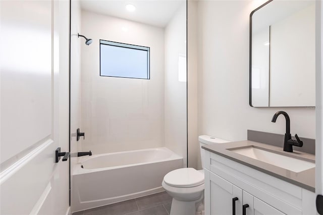 bathroom with toilet, vanity, tile patterned flooring, and bathing tub / shower combination