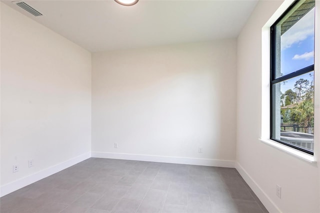 empty room featuring baseboards