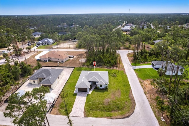 aerial perspective of suburban area with a heavily wooded area