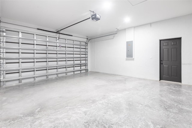 garage featuring electric panel and a garage door opener