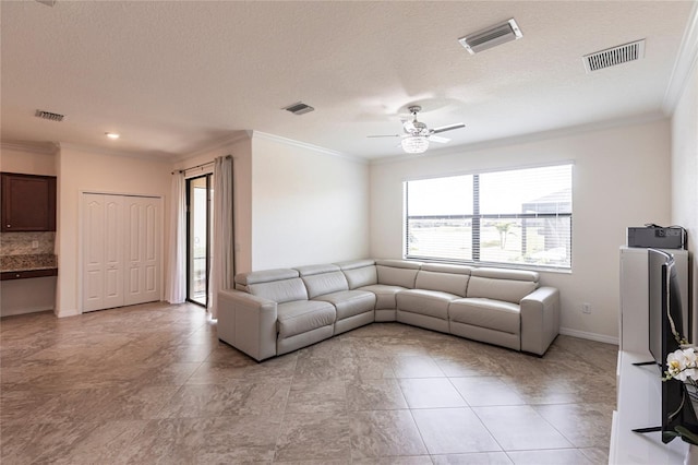 living room featuring visible vents and crown molding